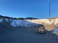 a skateboard ramp with graffiti on it