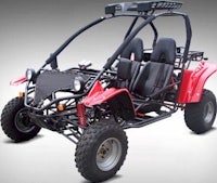 a red and black go - kart on a gray background