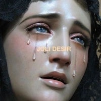a statue of a woman with tears on her face