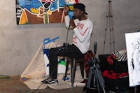 a man sitting on a stool