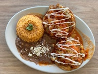 a plate of food with rice and beans on it