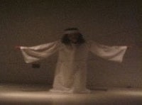 jesus in a white robe with his arms outstretched