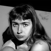 a black and white photo of a woman with long hair