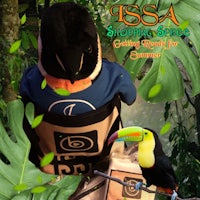 a toucan is sitting on top of a backpack
