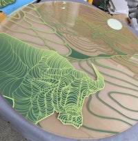 a table with a drawing of a bull on it