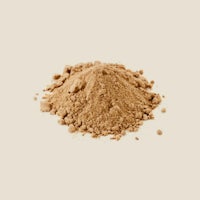 a pile of brown powder on a white background