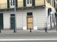 a building with a boarded up door on the side of it
