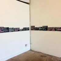 a room with several signs hanging on the wall