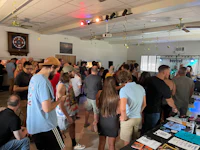 a crowd of people standing in a room