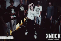 a group of people standing in a dark room