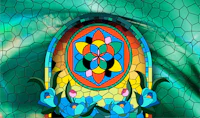 a stained glass window with a flower in the middle