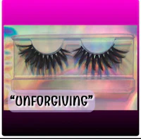 a pair of false eyelashes with the word forgiven on them