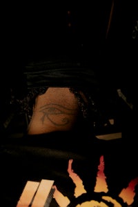 the back of a man with a tattoo on his head