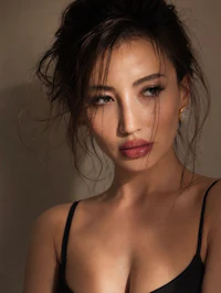 a woman in a black lingerie posing for a photo