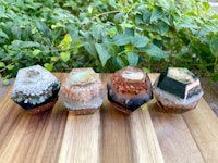 three different types of crystals on top of a wooden table