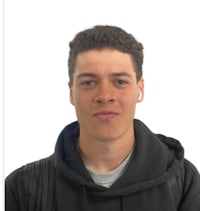 a young man wearing a black hoodie