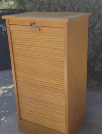 a wooden cabinet with a door on it