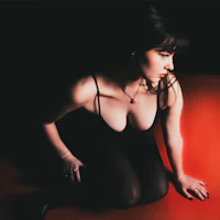 a woman is sitting on the floor