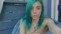 a woman with green hair is taking a selfie