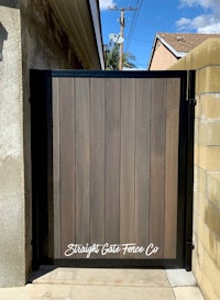 a wooden gate with the words straight edge frame up on it