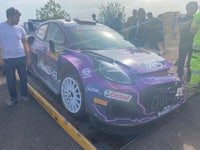 a ford fiesta rally car on a flatbed