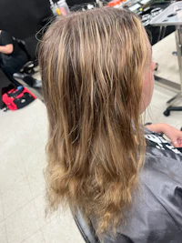 the back of a woman's hair in a salon
