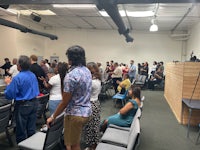 a group of people standing in a room