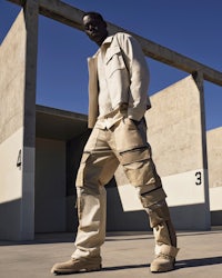 a man wearing cargo pants and a jacket