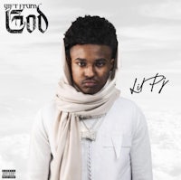 a man wearing a scarf is standing in the clouds