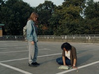 a woman kneeling on the ground