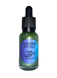 a bottle of a green liquid with the words'moon's kittons' on it