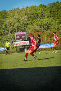 a group of people playing soccer on a field