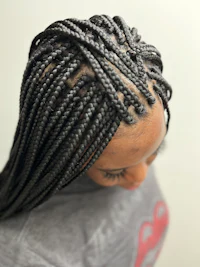 a woman with braids in her hair