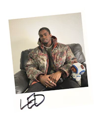 a man sitting on a couch with a teddy bear