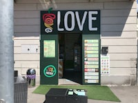 a store front with a sign that says love
