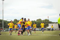 a group of men playing soccer on a field