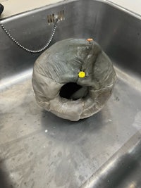 a plastic ball is sitting in a sink