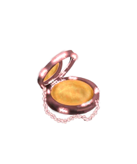 a compact with a gold lid on a white background