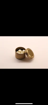 a gold tin on a white background