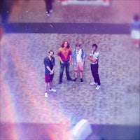 a group of people standing in an airport