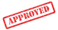 a red rubber stamp with the word approved on it