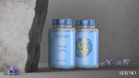 two bottles of water next to a stone wall