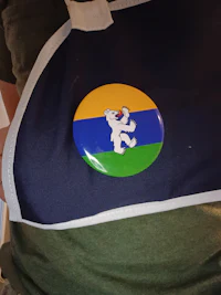 a person wearing an apron with a badge on it