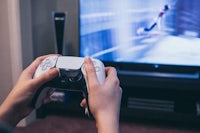 a person playing a video game in front of a television