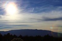 the sun is shining in the sky