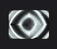 a black and white image of a circle on a black background
