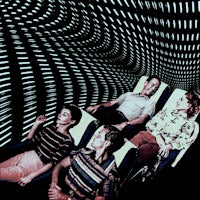a group of people sitting on a roller coaster