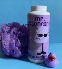a bottle of mr autocane with a rubber duck next to it