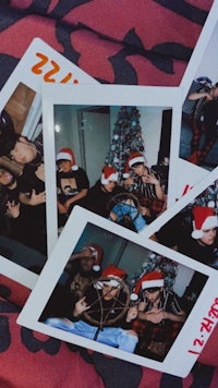 a group of people wearing santa hats and polaroid photos