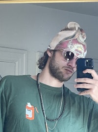 a man taking a selfie in a mirror